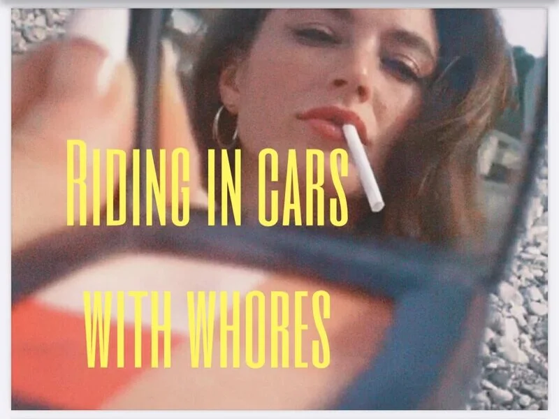 Riding in Cars with Whores - title card, a woman's reflection in a car mirror smoking a cigarette